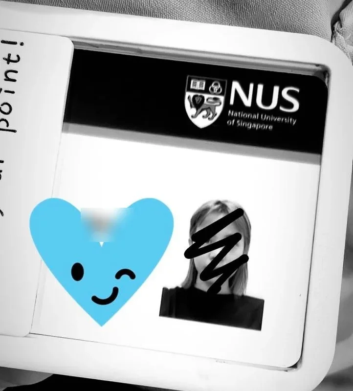 My NUS access pass in its holder, with my photo scribbled over and the card number covered by a sticker.