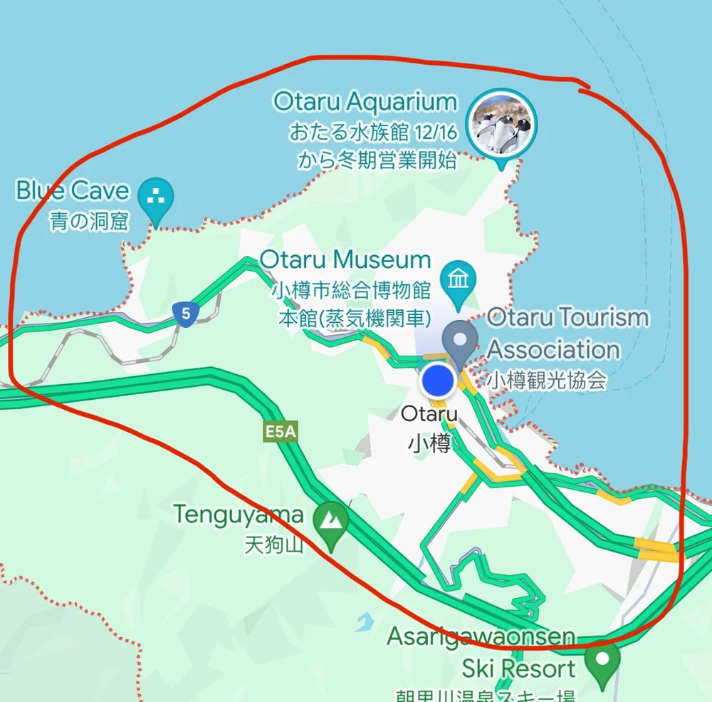 A map of Otaru with a hand-drawn red loop around the area I covered on foot, from the coast by the aquarium and the Blue Cave, past the Otaru Museum and the station, down towards Tenguyama.